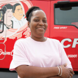 Student driver Fredricka Palmer poses beside her trainer’s She Drives CFI-wrapped truck. Those Who Deliver 4