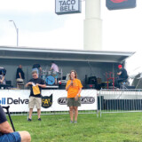 Delia Moon Meier, senior vice president of the Iowa 80 Group, and Eric Harley, co-host of Red Eye Radio, prepare to announce winners of the Super Truck Beauty Contest. (Linda Garner-Bunch/The Trucker)