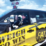 Tobias Owen, a driver for Kidd Transport of Rockford, Illinois, and his wife Shelby, won the CAT Scale Weigh to Win Sweepstakes and is now the proud owner of a new Ford F-150 Raptor. (Linda Garner-Bunch/The Trucker)