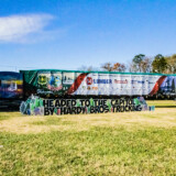The colorful Kenworth Tractor and festively adorned 80-foot flatbed trailer used to haul the tree attracted a lot of attention on the highway, according to drivers Ed and Deb Kingdon. (Courtesy: Truck PR)