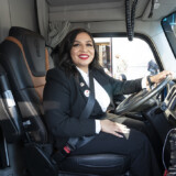 Ashley Leiva, winner of the Hiring Our Heroes Transition Trucking truck competition, checks out the new Kenworth truck she received as part of the award. (Ian Wagreich/U.S. Chamber of Commerce) Ashley Leiva