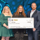 John Christner Trucking driver Rose Rojo, center, receives her $20,000 check from TCA as a new Professional Driver of the Year awardee (Courtesy: TCA) 23 03 07 Rojo TCA web
