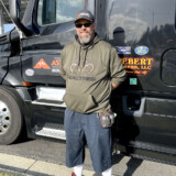 Truck driver Jeff Webert of Lake Havasu City, Arizona, picked up The Wall That Heals in San Luis Obispo, California, and transported it to Hawaiian Gardens, California. He will transport The Wall to Menifee, California, before driving to Texas to turn The Wall over to another driver. (Photo by Bobby Ralston of The Trucker Media Group)