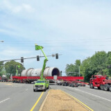 The kiln passes through the intersection of Highway 7 and Highway 376 on Friday, May 12, 2023.
Bucket trucks move the traffic lights to ensure no damage is done to them. (Courtesy: Arkansas Department of Transportation) Kiln