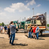 Families of workers pose with classic big rigs before the second annual Kenworth Chillicothe Plant's Kenworth Truck Parade held on June 18, 2023. (Courtesy: Kenworth) Kenworth Parade