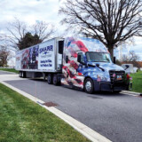 Sharp Transportation also takes part in Wreaths Across America , an initiative that works to place evergreen wreaths on the graves of military veterans. (Courtesy: Sharp Transportation) Wreaths Across America 1