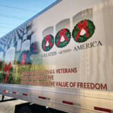 Sharp Transportation also takes part in Wreaths Across America , an initiative that works to place evergreen wreaths on the graves of military veterans. (Courtesy: Sharp Transportation) Wreaths Across America 1
