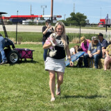 Eva Knelsen and Dixie share the limelight during the 2023 Trucker's Best Friend competition at the Walcott Truckers Jamboree. (Linda Garner-Bunch/The Trucker)