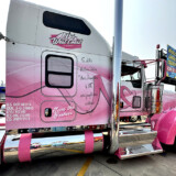 Eva Knelsen says she loves traveling the highways in Ken Worth Jr., a pink and white W900L that honors cancer survivors. (Linda Garner-Bunch/The Trucker)