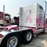 Eva Knelsen says she loves traveling the highways in Ken Worth Jr., a pink and white W900L that honors cancer survivors. (Linda Garner-Bunch/The Trucker)