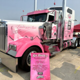 Eva Knelsen says she loves traveling the highways in Ken Worth Jr., a pink and white W900L that honors cancer survivors. (Linda Garner-Bunch/The Trucker)
