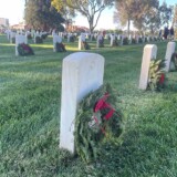 Volunteers placed wreaths on veterans' graves on Saturday, Dec. 16, 2023, at Los Angeles National Cemetery as part of Wreaths Across America. (Bobby Ralston/Trucker News Staff) Wreaths Across America at Los Angeles National Cemetery