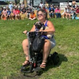 “Benji” (aka “Puggles”) and human companion Dawn Chase of New Hartford, Iowa (Linda Garner-Bunch/The Trucker)