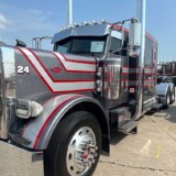Mike Brown took home first place in the Working Truck: 2005-2000 Bobtail Conventional category with a gray and red 2005 Peterbilt 379. (Linda Garner-Bunch/The Trucker)