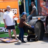 Attendees enjoy a game of baggo at one of the vendor stalls. (Courtesy: Iowa 80 Group)