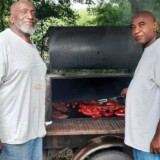As a driver trainer, White has forged numerous bonds and lasting friendships. Here, he and former trainee Robert Jones prepare a feast for friends. (Courtesy: James White)