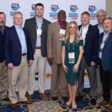 During the Truckload Carriers Association’s 2024 convention, held in Nashville in March, White and the P&S Transportation team stop for a group photo. (Courtesy: Truckload Carriers Association)