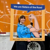 Anne-Marie Michel flexes her muscles during the "Sisters of the Road" U.S. Tour. (Courtesy: Anne-Marie Michel Photography)