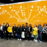 During the Mid America Trucking Show in March, Anne-Marie Michel and several of the "Sisters of the Road" drivers pose with Uber Freight crew and other show attendees. (Courtesy: Anne-Marie Michel Photography)