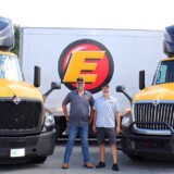 Tyrone Burcham (left) and his brother Wade Burcham have followed similar paths as professional drivers. Each has achieved 2.5 million safe miles with Estes — and nearly 4 million miles in their respective careers. (Courtesy: Estes)