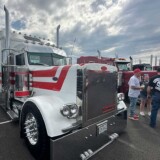 Gary Dean Jones Jr. shares details about his 1999 Peterbilt 379, dubbed "EZE Money," during the 2025 Mid America Trucking Show. (Linda Garner-Bunch/The Trucker)