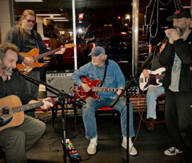 Long Haul Paul Marhoefer, far left, jams with Travis Wammack (center) and other musicians. (Photo courtesy of Paul Marhoefer via Facebook)